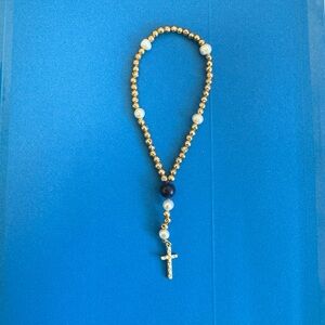 Gold colored 7 inch rosary with fresh water pearls and lapis lazuli bead.